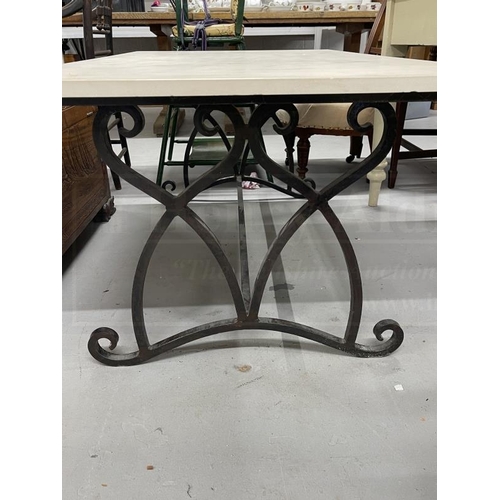 58 - Gardenalia: Wrought iron table base with composite top. 50ins. x 28ins.