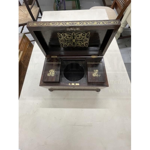 67 - 19th cent. Rosewood sarcophagus shaped tea caddy with brass inlay, fitted with two tea compartments,... 