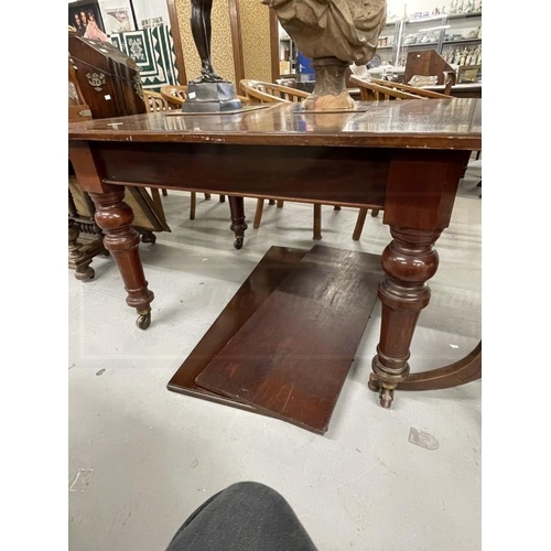 76 - 19th cent. Mahogany extending dining table on turned supports with castors, two inserts. Closed 48in... 