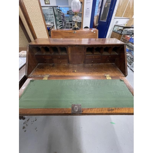 92 - 19th cent. Mahogany bureau with three long and two short drawers, fitted interior. 42ins. x 21ins. x... 