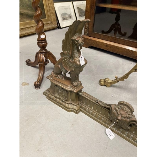 97 - 19th cent. French adjustable cast brass Griffin fireplace chevets and fender set. Height 17ins. x 46... 