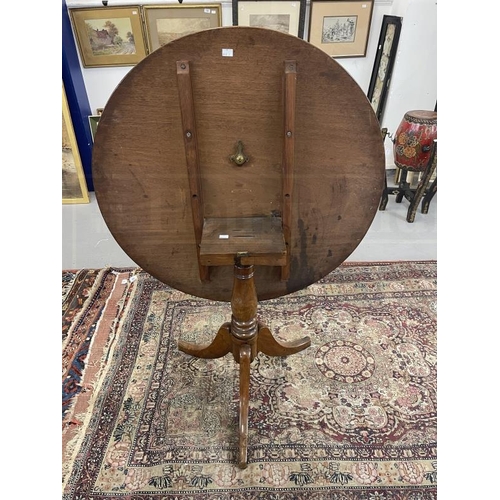 98 - 19th cent. Mahogany tilt top table, circular top, turned column, splayed legs. 28ins. x 34ins.