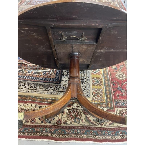 99 - Regency mahogany circular breakfast table on single column and four splayed supports. 52ins.