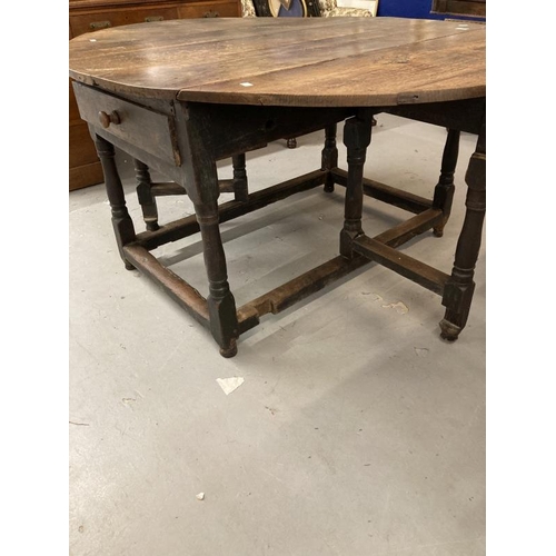 99 - 18th cent. Oak gate leg table, single drawer to each end on turned supports with a tied stretcher, l... 