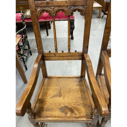 115 - Oak Derbyshire style Gothic carver chairs the backs with upturned spindles with carved arched tops a... 