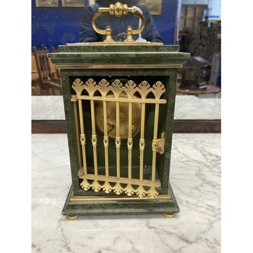 143 - Clocks: French Empire style Le Castel mantel clock, malachite style case with gilt metal mounts on a... 