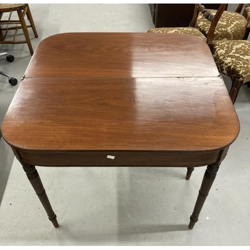 49 - Early 19th cent. Mahogany tea table on turned ring supports. 35¼ins. x 17¼ins. x 34½ins.