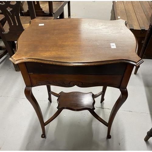 57 - Edwardian ladies writing desk the shaped mahogany moulded top opening to reveal a fold out writing s... 