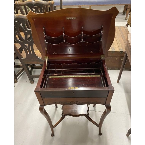 57 - Edwardian ladies writing desk the shaped mahogany moulded top opening to reveal a fold out writing s... 