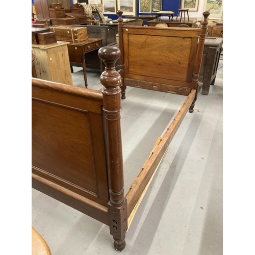 69 - Late 19th/early 20th cent. Mahogany bed with square moulded panels flanked by turned columns, slight... 