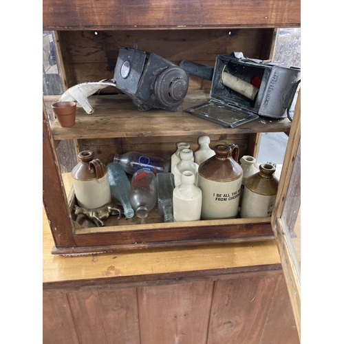 73 - Late 19th/early 20th cent. Pine cupboard with glass door and sides, single shelf. Contents to includ... 