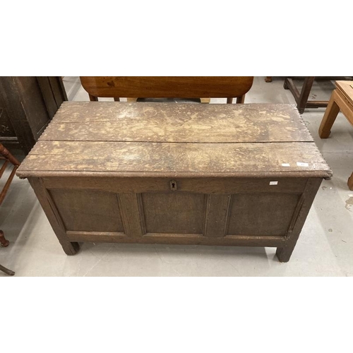 83 - Late 18th cent. Oak coffer the two plank top with moulded edge to the front. The front with three pa... 