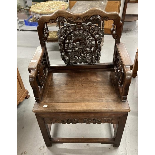 86 - 19th cent. Chinese hardwood armchair, the back with shaped top rail, central carved panel of lion do... 