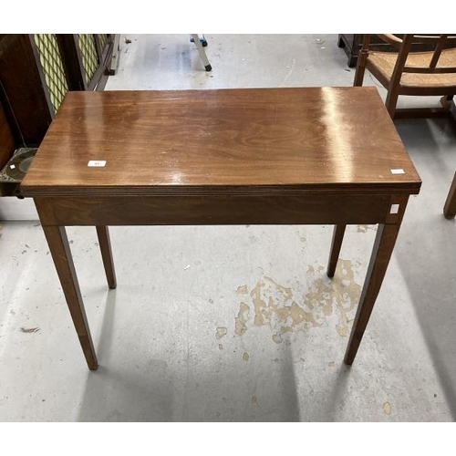 89 - 19th cent. Mahogany tea table, the rectangular top with reeded edge on squared tapered legs. 34ins. ... 