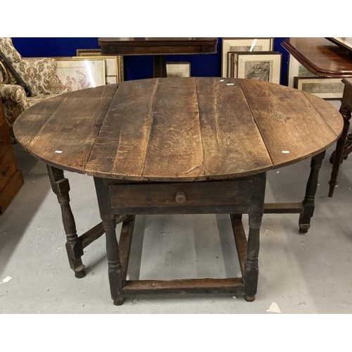 99 - 18th cent. Oak gate leg table, single drawer to each end on turned supports with a tied stretcher, l... 