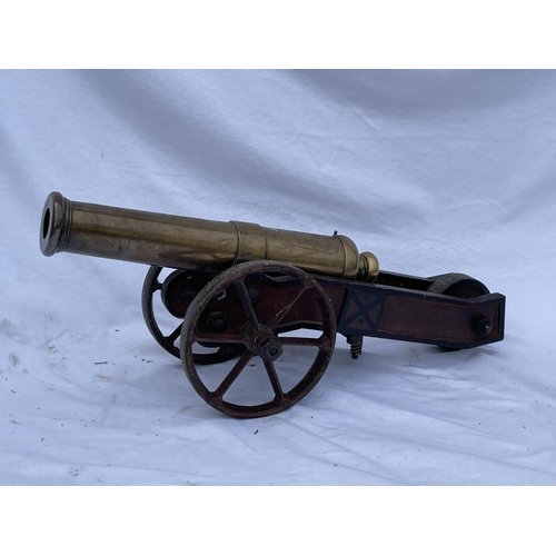 10 - MILITARIA: A mid-19th century brass signal cannon, with cylindrical barrel on a shaped truckle base,... 