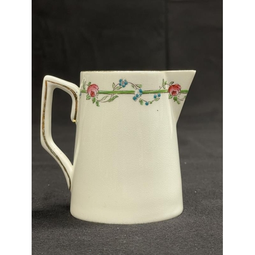 140 - WHITE STAR LINE: First-Class milk jug bearing a Rose design. 3¾ins.