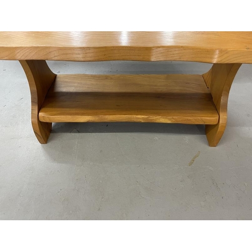 96 - Light oak coffee table with shelf. 42ins. x 19ins. x 19ins. Dark oak coffee table with a stretcher. ... 