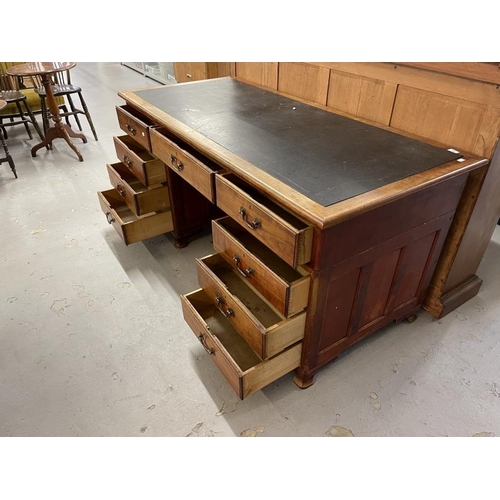 99 - Edwardian mahogany stained nine drawer twin pedestal desk with brass drop handles. Approx. 66ins. x ... 