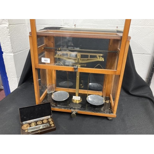 203 - Scientific Instruments: 19th cent. Laboratory scales in glazed beech cabinet, with weights, manufact... 