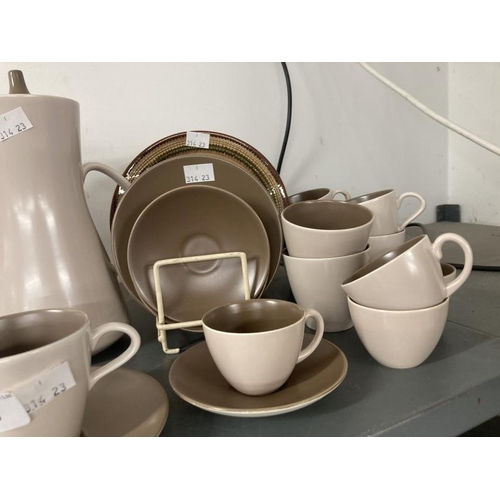 205 - 20th cent. Ceramics: Poole Pottery, two part tea/coffee sets. Brown/cream set comprising coffee pot,... 