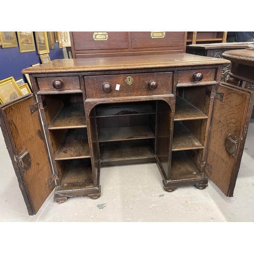 103 - 19th cent. Oak kneehole desk, three drawers across the top, with a door either side revealing shelve... 