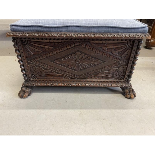 108 - 19th cent. Oak carved footstool on paw feet supports. Approx 26ins. x 26ins. x 15ins.