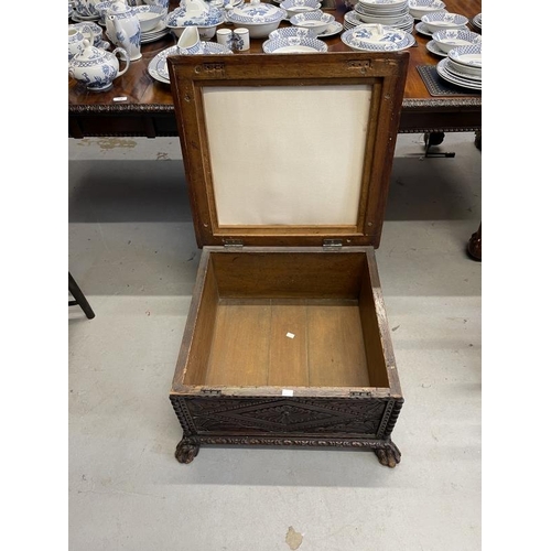 108 - 19th cent. Oak carved footstool on paw feet supports. Approx 26ins. x 26ins. x 15ins.