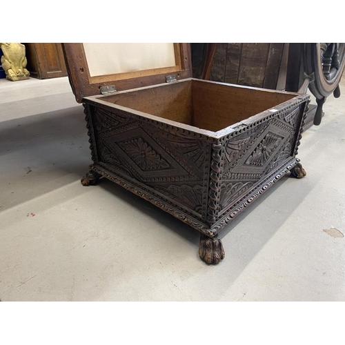 108 - 19th cent. Oak carved footstool on paw feet supports. Approx 26ins. x 26ins. x 15ins.