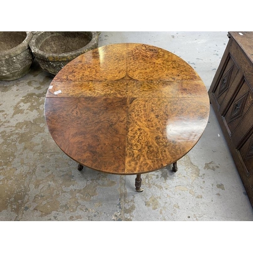 111 - 19th cent. Burr walnut Sutherland table on brass and ceramic castors. Approx. 41ins. x 36ins (when o... 