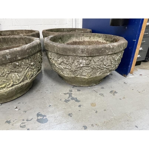 124 - Gardenalia: Mid 20th cent. Pair of large reconstituted planters with vine and leaf decoration. Dia. ... 