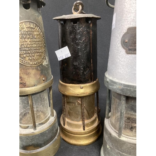 185 - Miners Safety Lamps: 19th cent. Protector x 2, J.F. Naylor plus one other. (4)