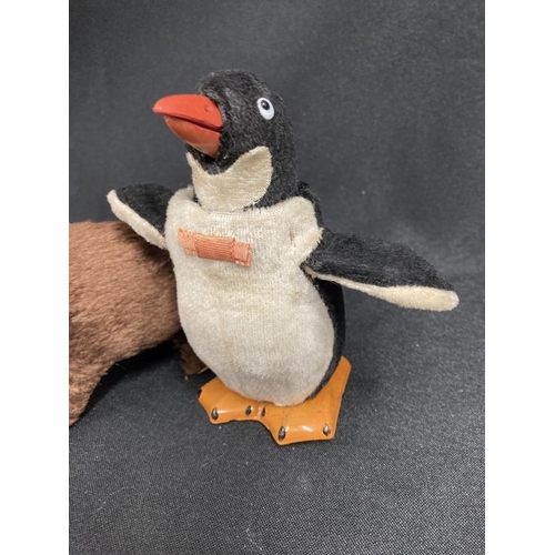 256 - Toys: 20th cent. Japanese clockwork 'Modern Toys' Jolly Penguin and Walking Bear both with original ... 