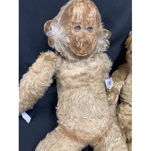 259 - Toys: Continental mohair teddy bear, glass eyes (one loose), black wool nose, straw filled. Wear to ... 