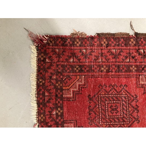 35 - Carpets & Rugs: 20th cent. Turkman rug, red ground, three borders, eighteen full guls, all in reds, ... 