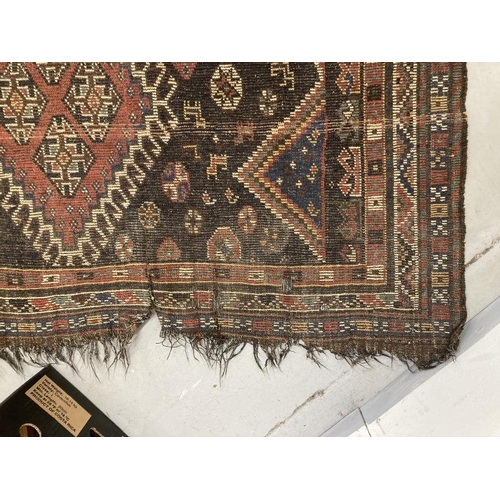 37 - Carpets & Rugs: Early 19th cent. Handmade Kazak rug, black ground, six borders and a central panel w... 