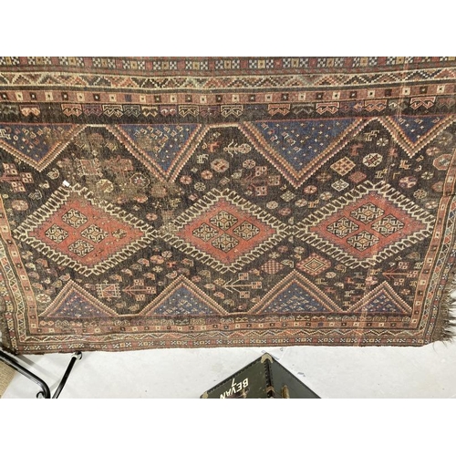 37 - Carpets & Rugs: Early 19th cent. Handmade Kazak rug, black ground, six borders and a central panel w... 