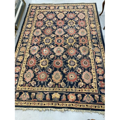 38 - Carpets & Rugs: Oriental woollen carpet black and navy blue ground, two borders and central panel of... 