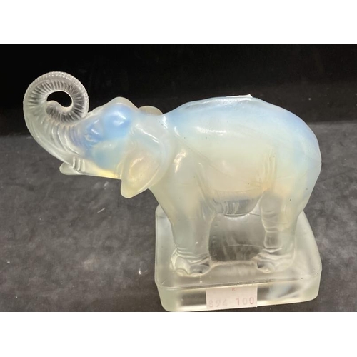 439 - The Mavis and John Wareham Collection: Jobling Art Glass: Opalescent elephant with raised trunk on o... 