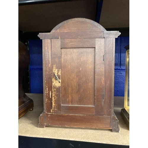 460 - Clocks: Edwardian mahogany mantel clock arched top, columns to the sides with an inlaid urn to the f... 