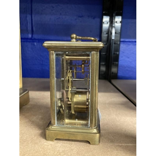 462 - Clocks: French brass carriage clock, white enamel face, Roman numerals. 4½ins.