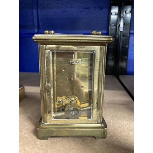 462 - Clocks: French brass carriage clock, white enamel face, Roman numerals. 4½ins.