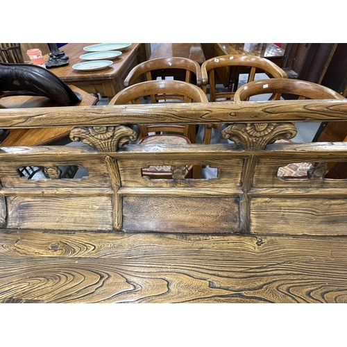 52 - Chinese elm bench with weathered finish, shaped panelled back solid seat on shaped cut out legs with... 