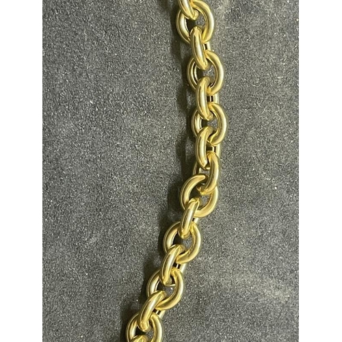 566 - Jewellery: Yellow metal curb link bracelet, tests as 18ct gold. Length 7ins. Weight 15.3g.