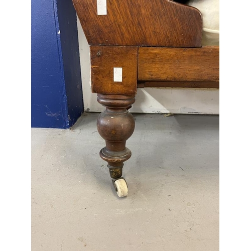 61 - 19th cent. Mahogany cream upholstered chaise on brass castors.