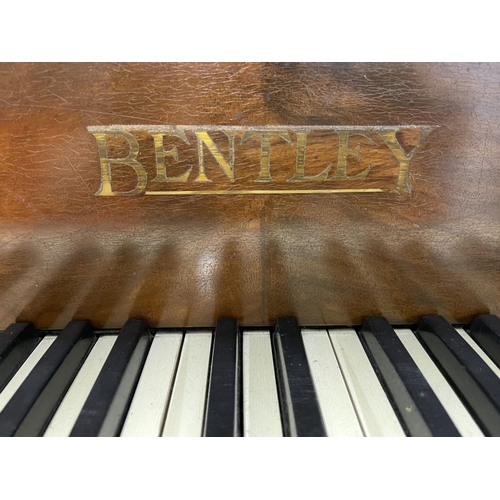 66 - 20th cent. Piano by Bentley, iron frame over strung in a rosewood and walnut case. Approx. 45ins. x ... 