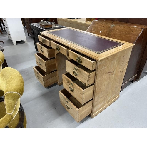 91 - 19th cent. Pine nine drawer knee hole desk with brass handles. 48½ins. x 23ins. x 33ins.