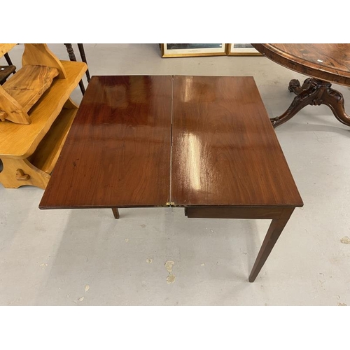 95 - 19th cent. Mahogany tea table, the rectangular top with reeded edge on squared tapered legs. 34ins. ... 