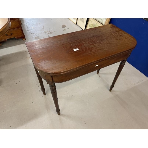 97 - Early 19th cent. Mahogany tea table on turned ring supports. 35¼ins. x 17¼ins. x 34½ins.