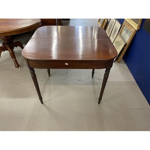 97 - Early 19th cent. Mahogany tea table on turned ring supports. 35¼ins. x 17¼ins. x 34½ins.